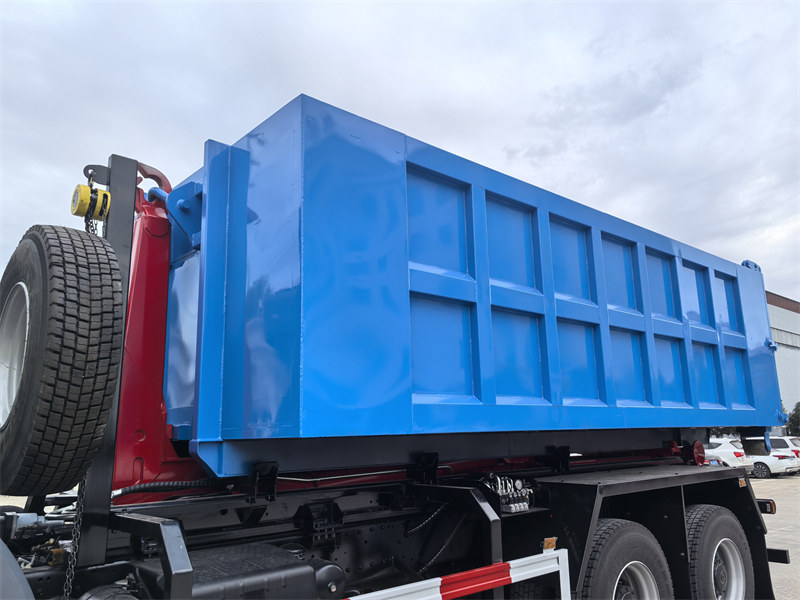 Hydraulic hook loader arm device